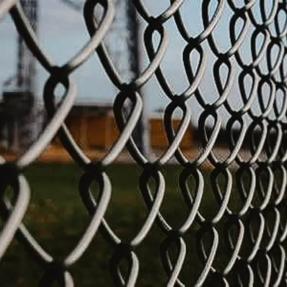 Chain-link metal fence providing security and outdoor visibility.