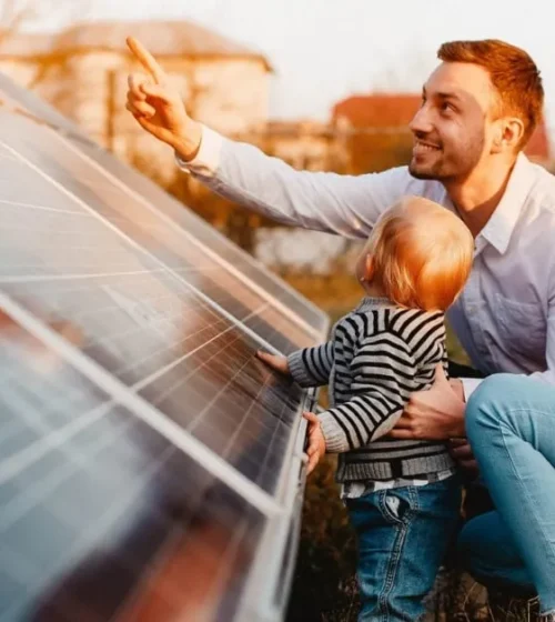 A family interacting with solar panels, highlighting the connection between renewable energy and sustainable practices.