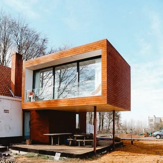 Modern home extension with large windows, blending seamlessly with the existing structure.