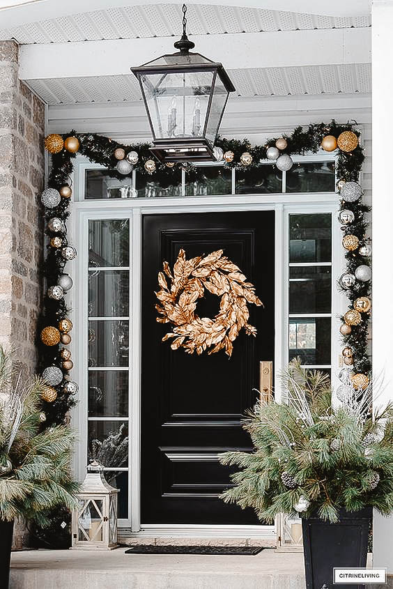 You can see a front porch decorated in a chic look.