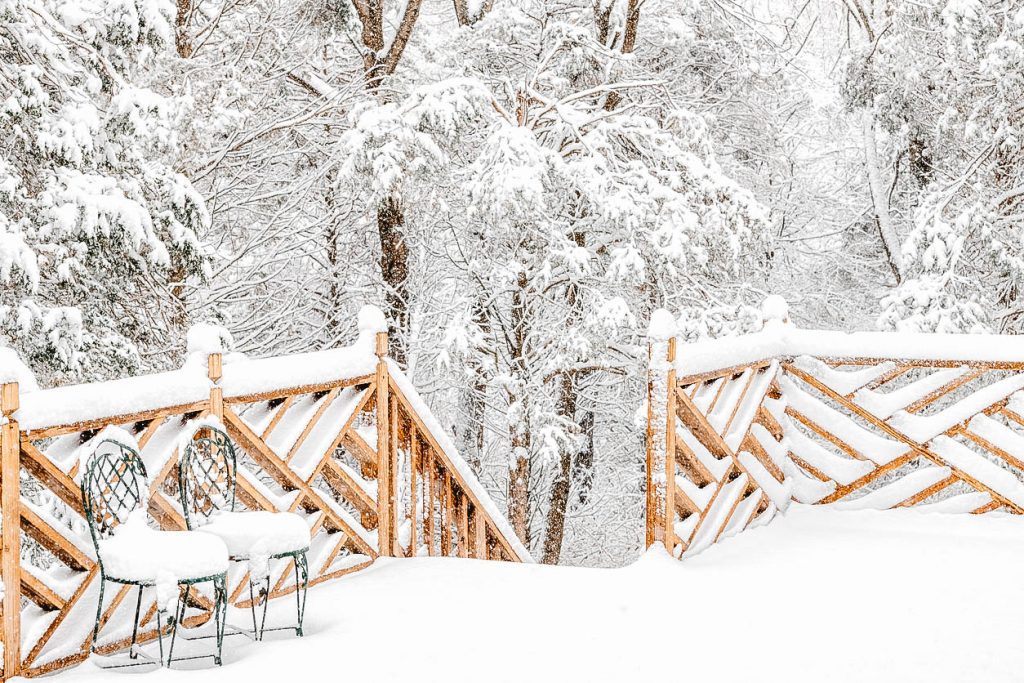 You can see a deck covered in snow.