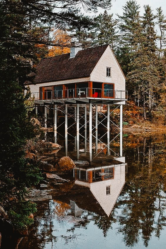 You can see a cottage near the lake.