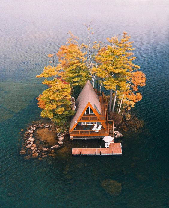 You can see a cottage on an island.