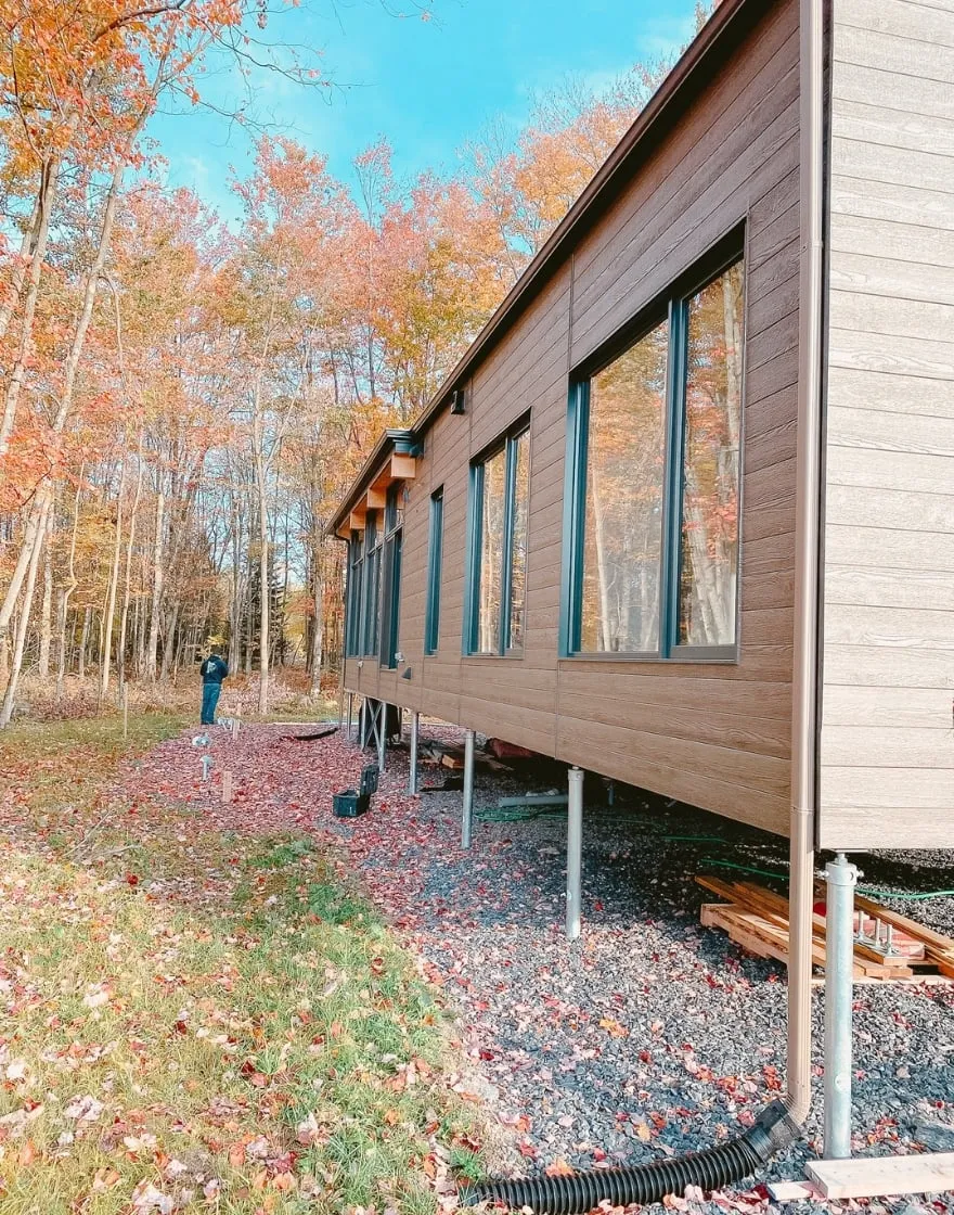 Forest cabin elevated on screw piles during construction