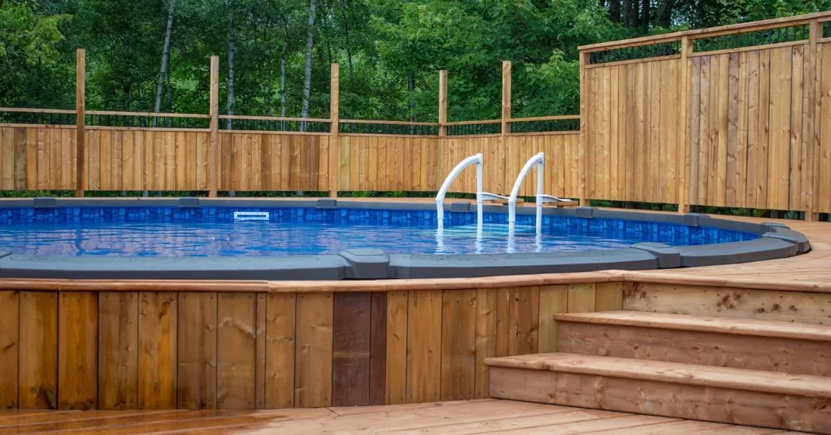 Elevated above-ground pool deck surrounded by wooden fencing, demonstrating the structural support offered by screw piles.