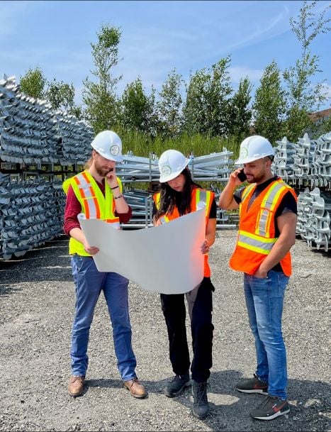3 engineers who's looking at a plan
