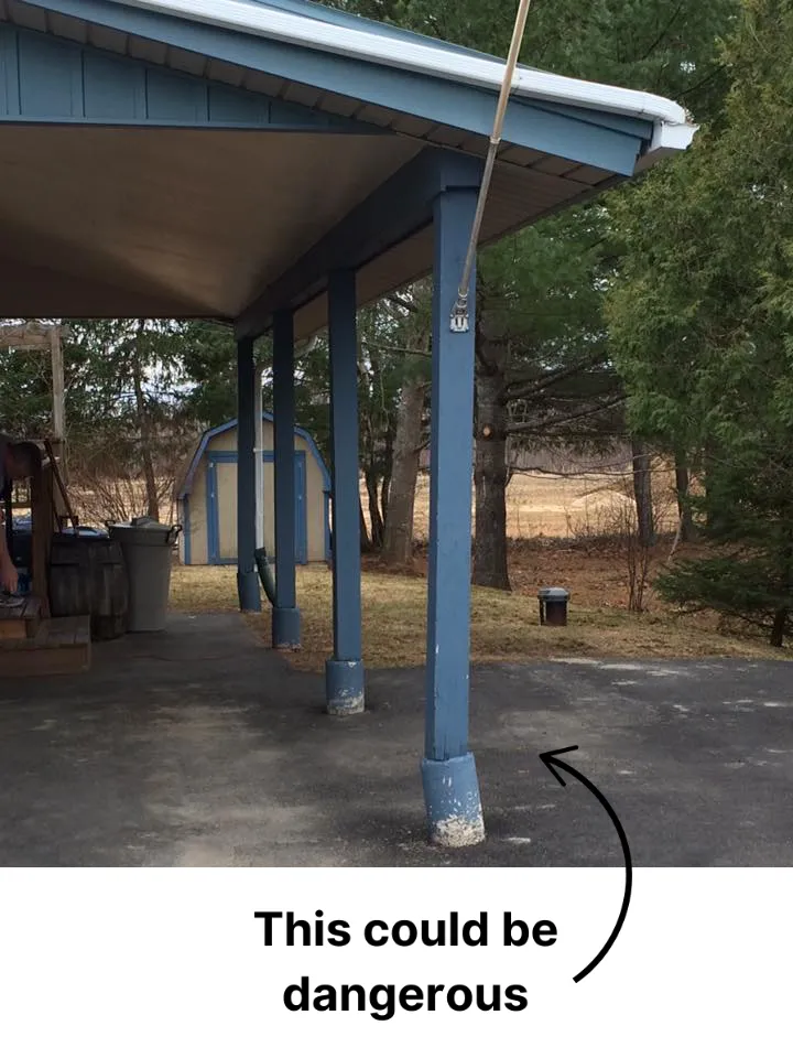 Leaning support beams under a carport showing signs of instability, highlighting the need for strong and stable foundation repairs with screw piles.