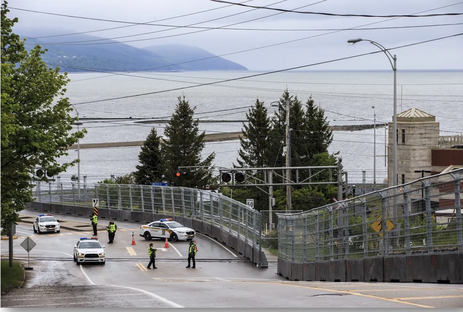 Scenic coastal road with traffic control in place.